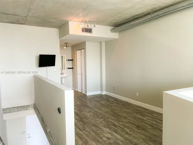 a view of a bathroom with a sink and a mirror