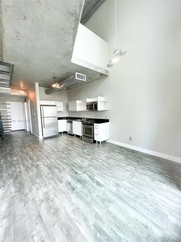 a view of kitchen and sink