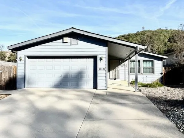 a front view of a house with a garage