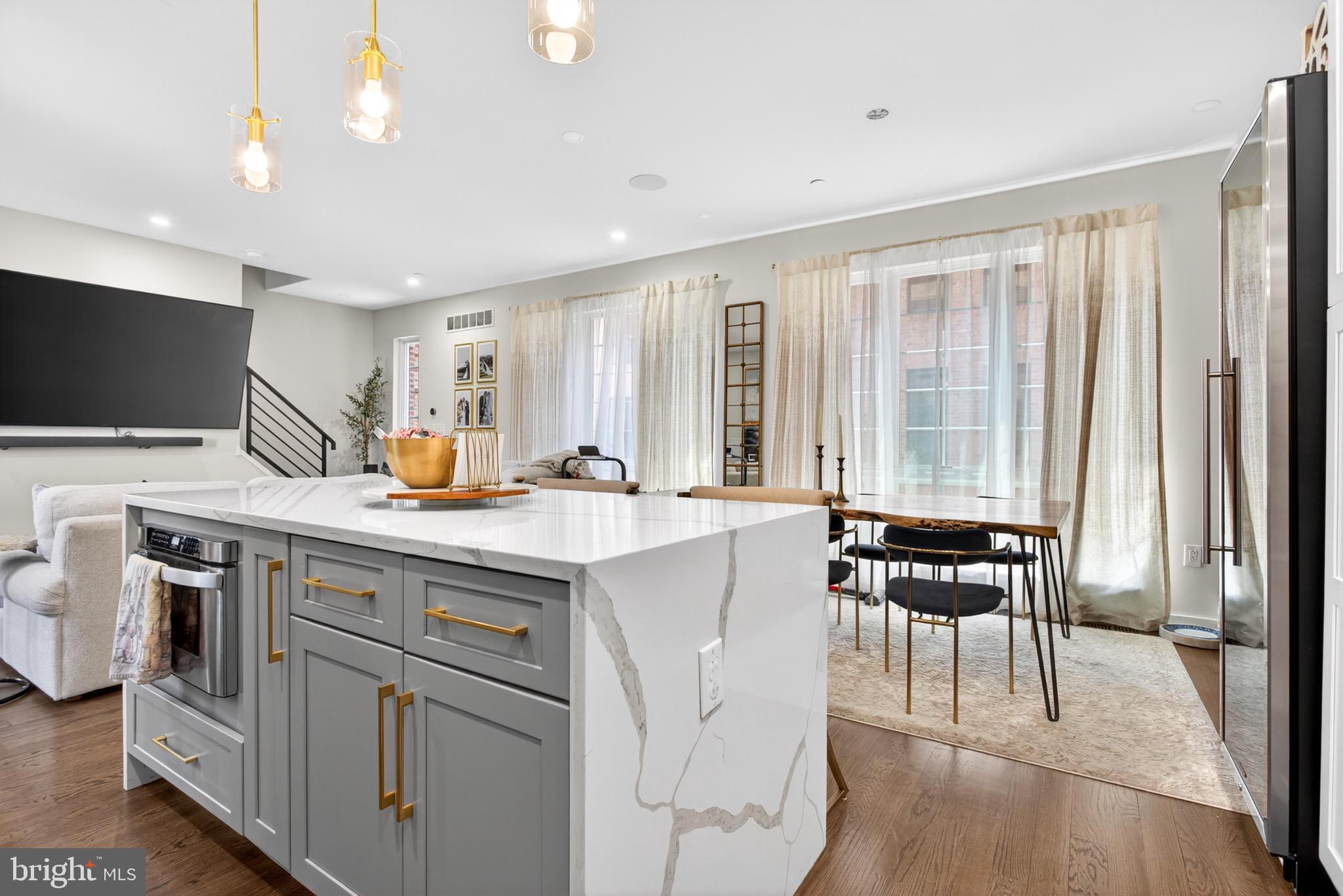 2411 Innovator Way Philadelphia, PA 19146 - Photo 9 of 26 a kitchen with a sink stove and chairs