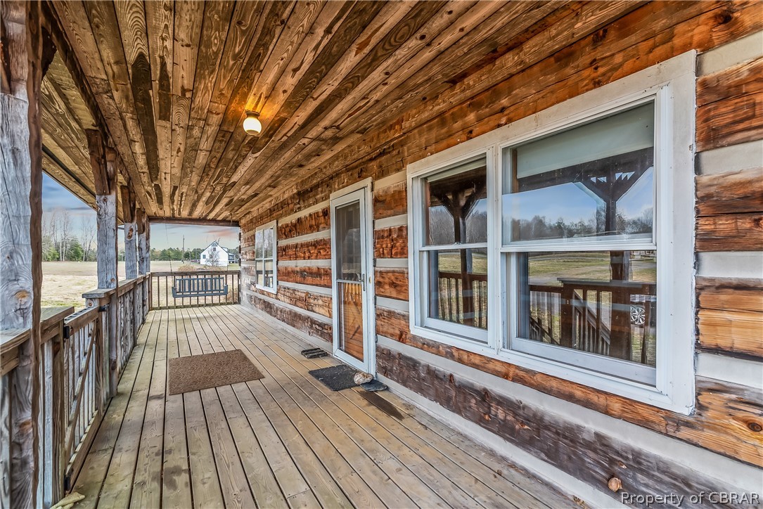 1371 Milby Town Road Shacklefords, VA 23156 - Photo 2 of 27 Front porch with swing at far end.