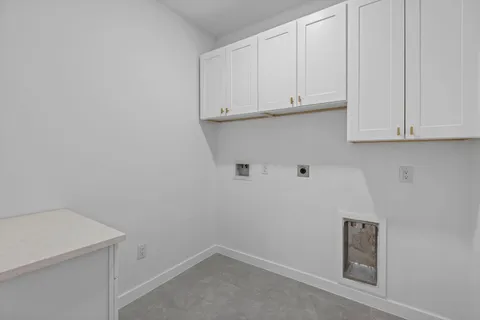 a bathroom with a granite countertop sink a toilet and with mirror