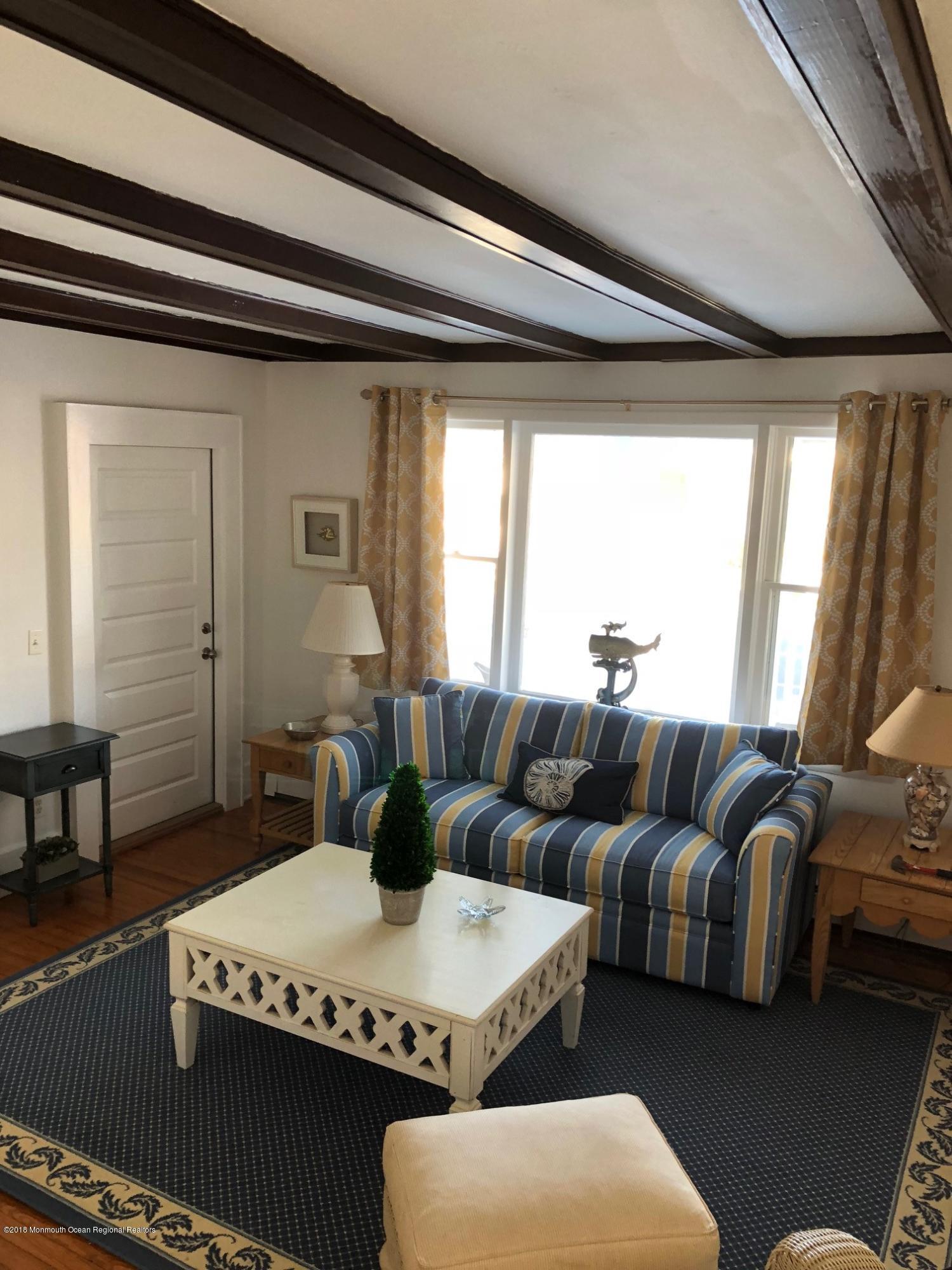 632 Main Avenue, Unit 1 Bay Head, NJ 08742 - Photo 2 of 16 a living room with furniture and a large window