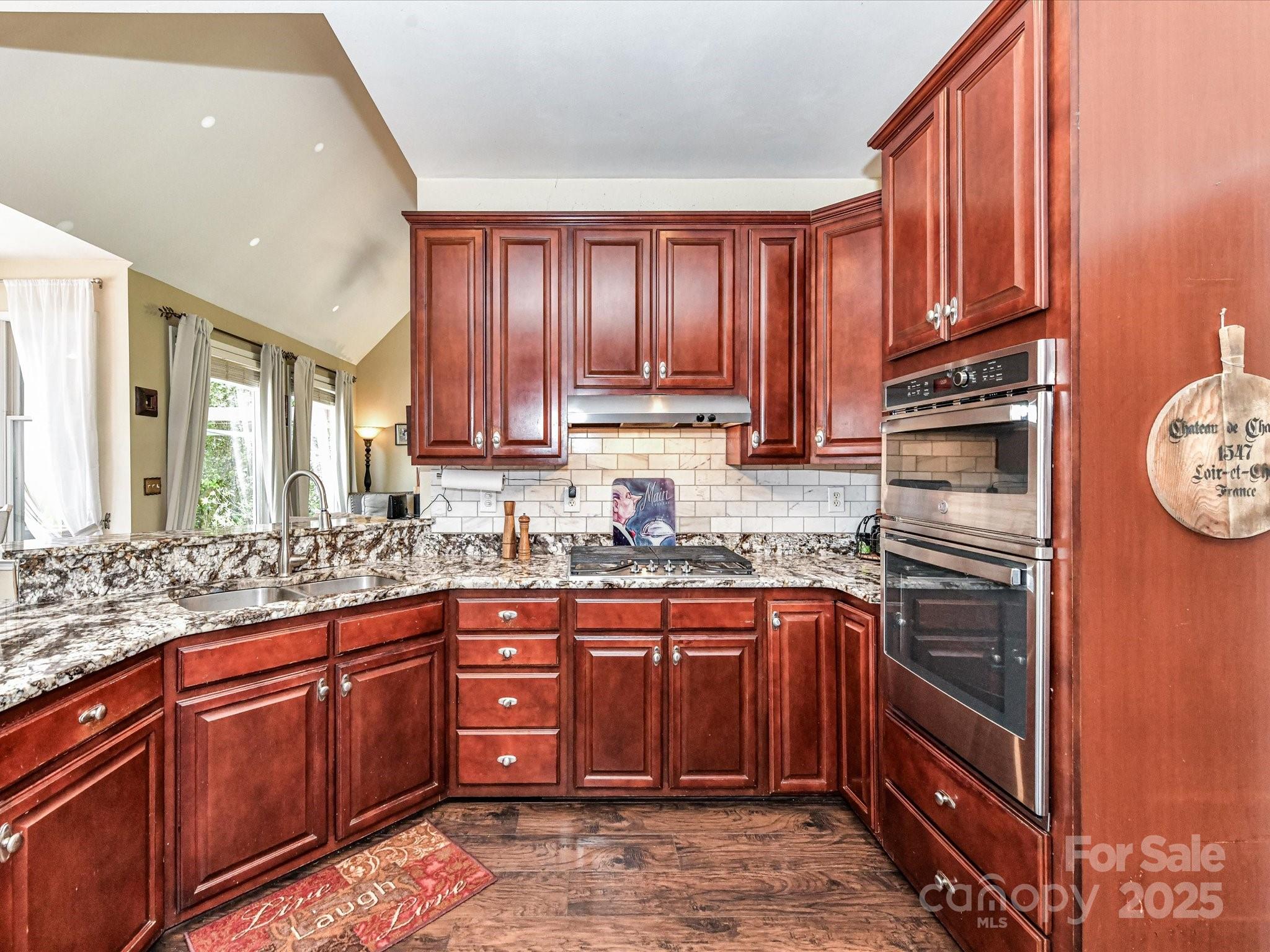 2325 Perry Road Denver, NC 28037 - Photo 16 of 48 a kitchen with stainless steel appliances granite countertop wooden cabinets a sink and dishwasher