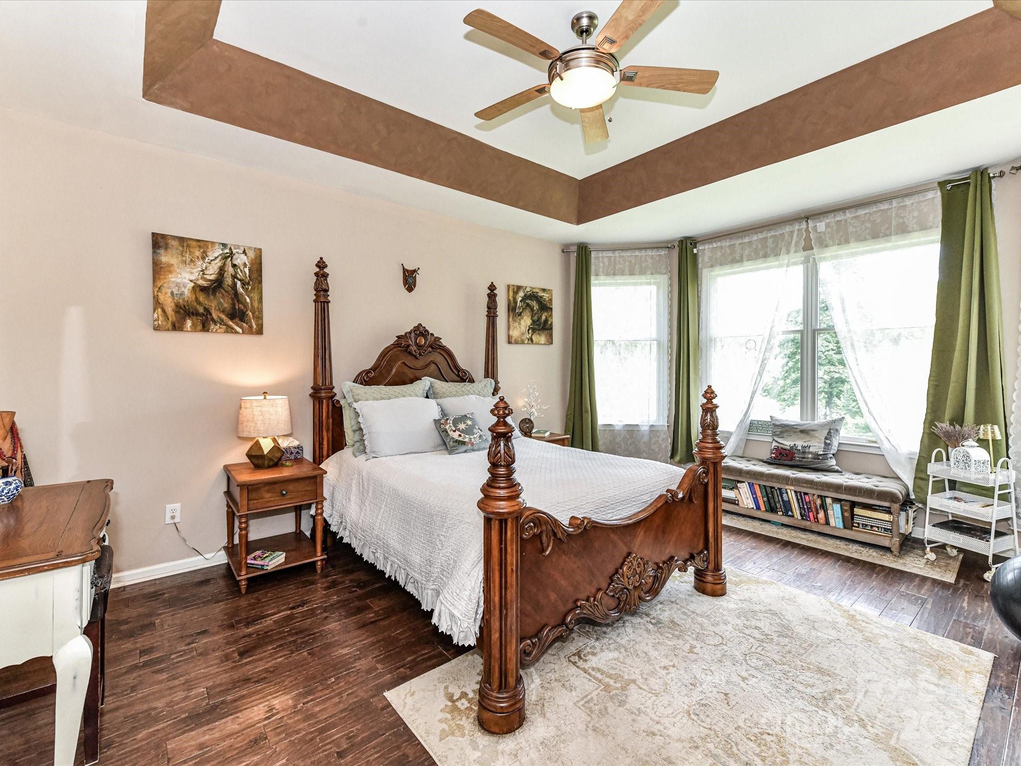 2325 Perry Road Denver, NC 28037 - Photo 21 of 48 a bed room with a bed and a chandelier