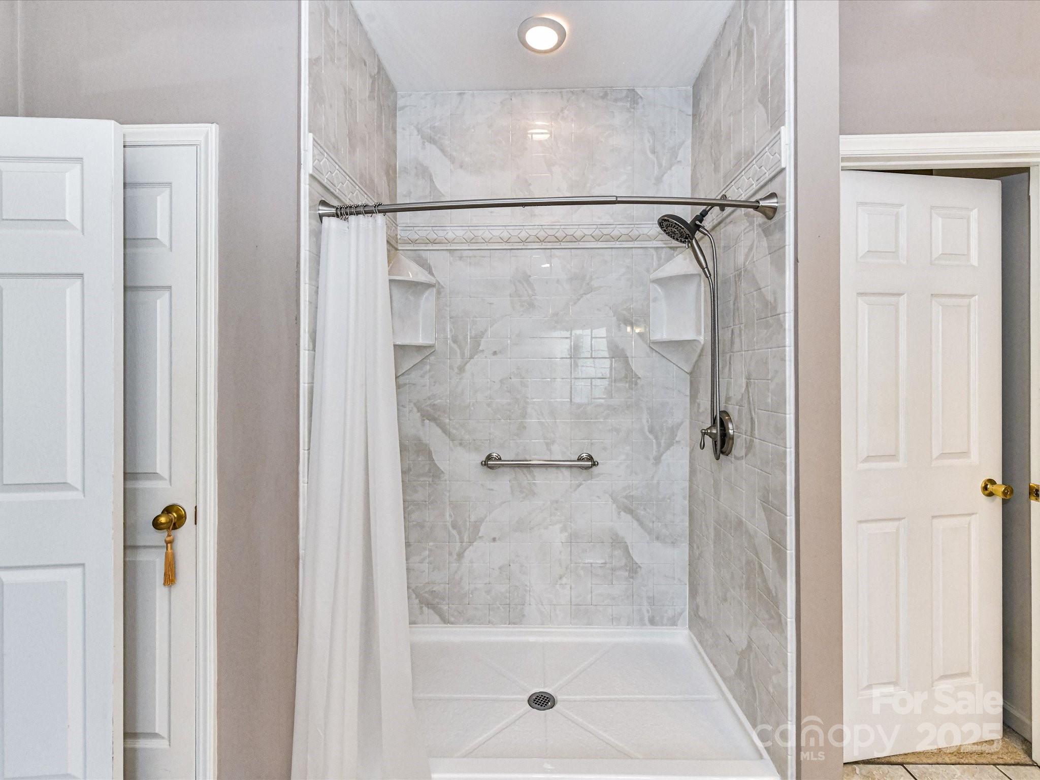 2325 Perry Road Denver, NC 28037 - Photo 24 of 48 a bathroom with a glass shower door