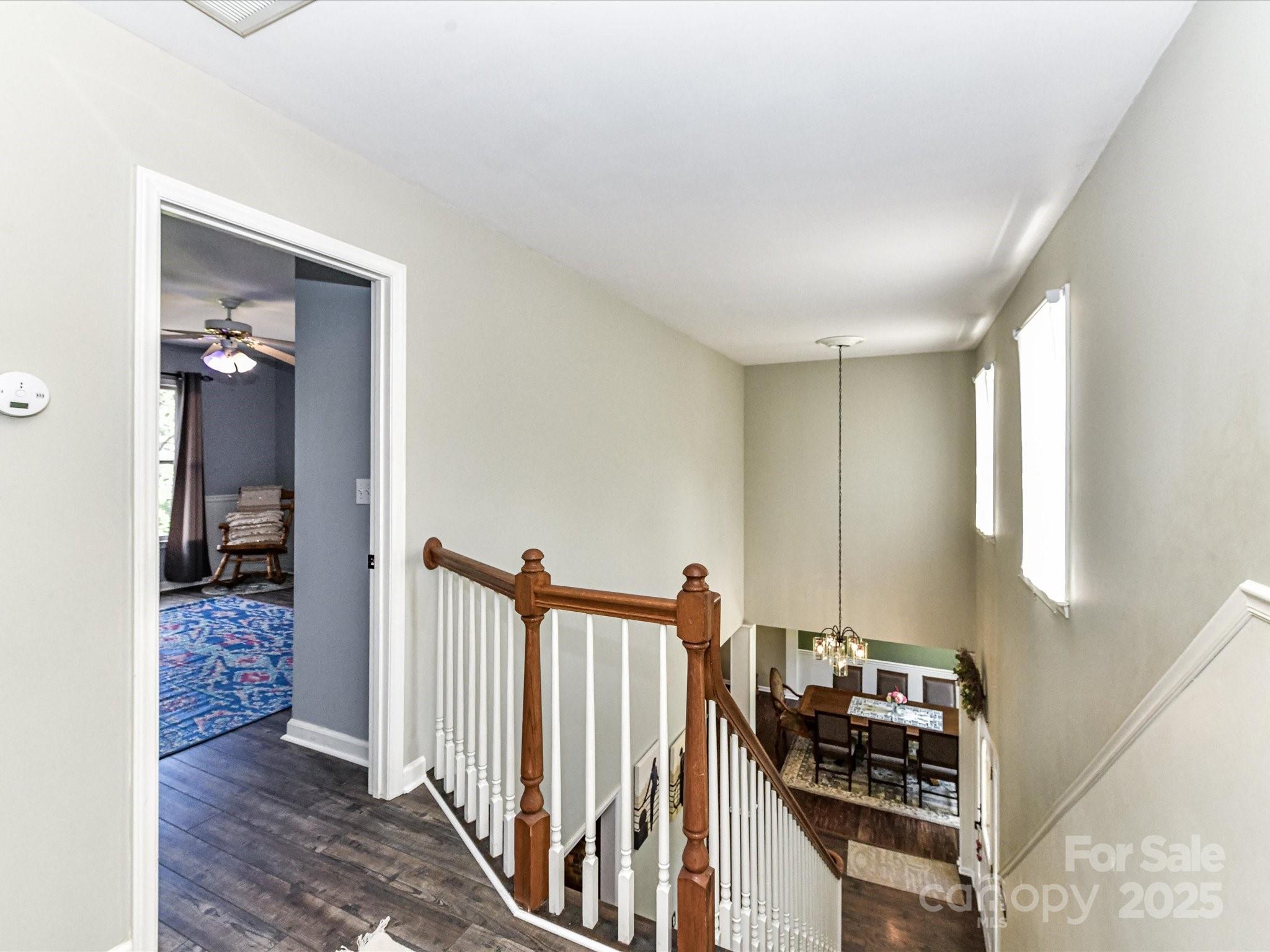 2325 Perry Road Denver, NC 28037 - Photo 26 of 48 a view of a hallway with wooden floor and a living room