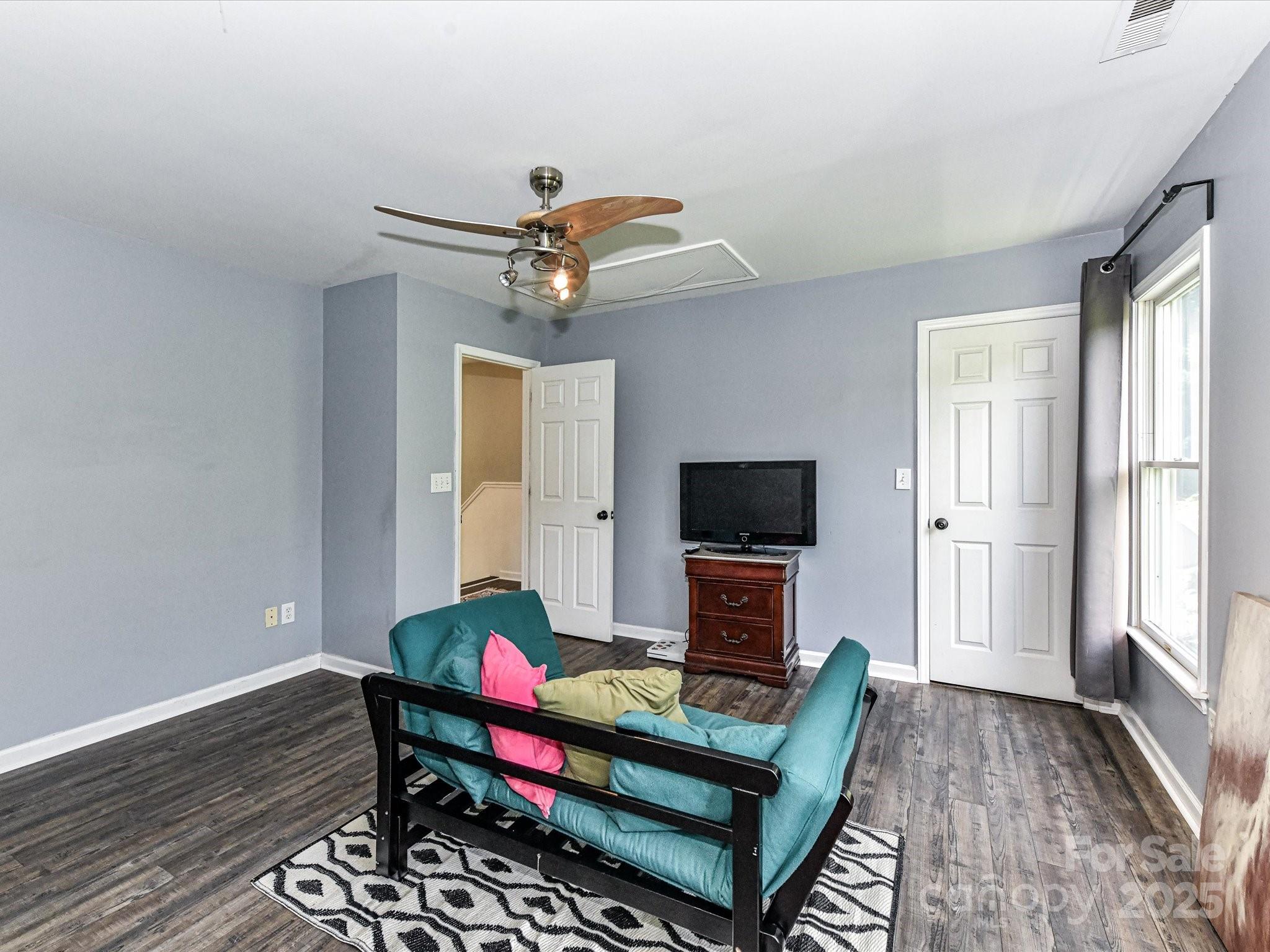 2325 Perry Road Denver, NC 28037 - Photo 30 of 48 a living room with furniture and a flat screen tv