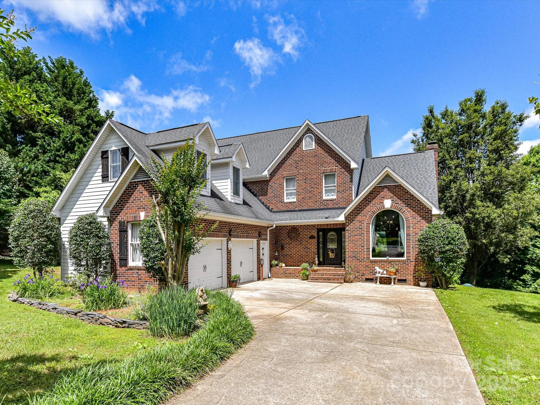 2325 Perry Road Denver, NC 28037 - Photo 3 of 48 a front view of a house with a yard