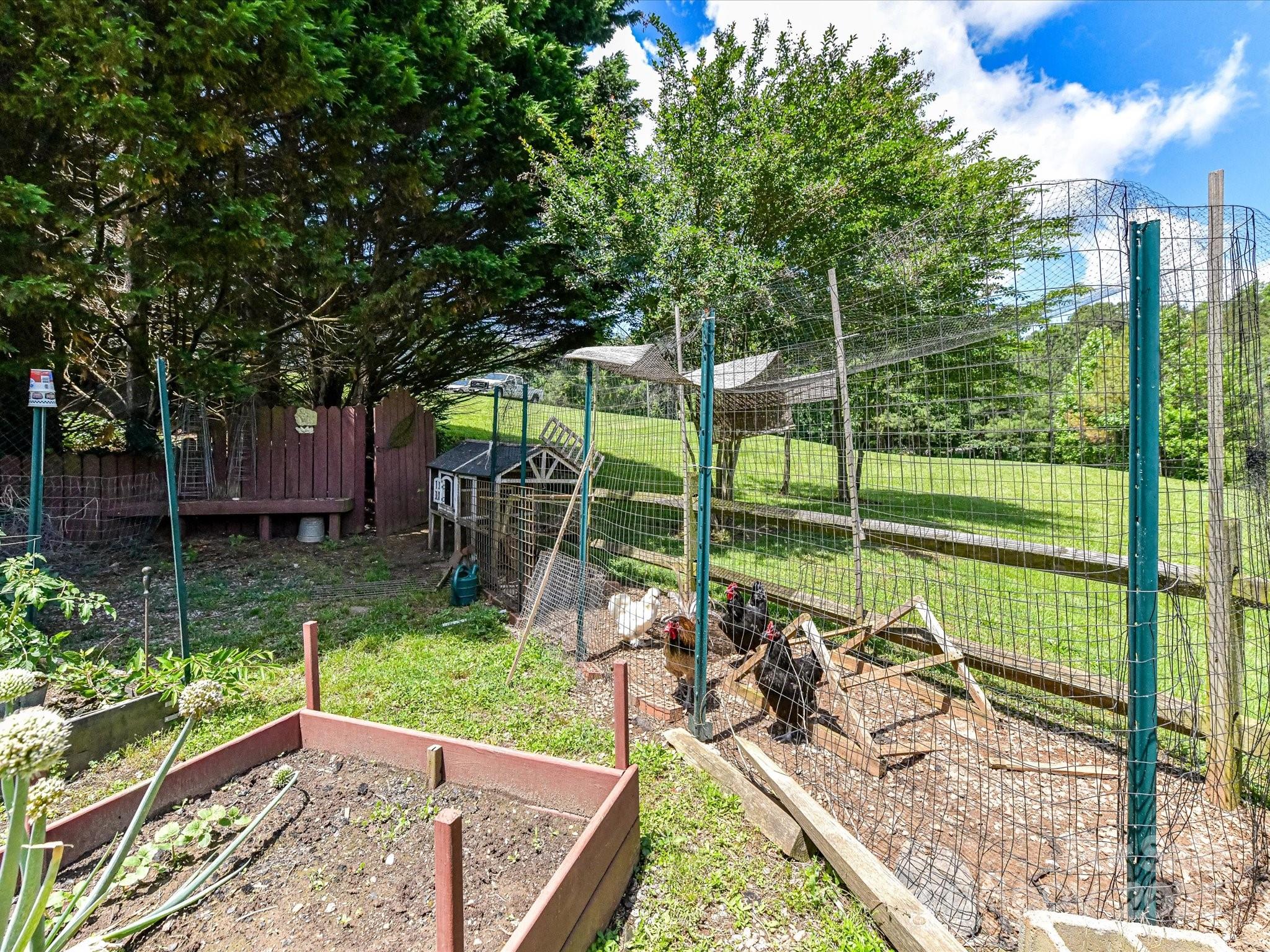 2325 Perry Road Denver, NC 28037 - Photo 41 of 48 a view of a chair and tables in the garden