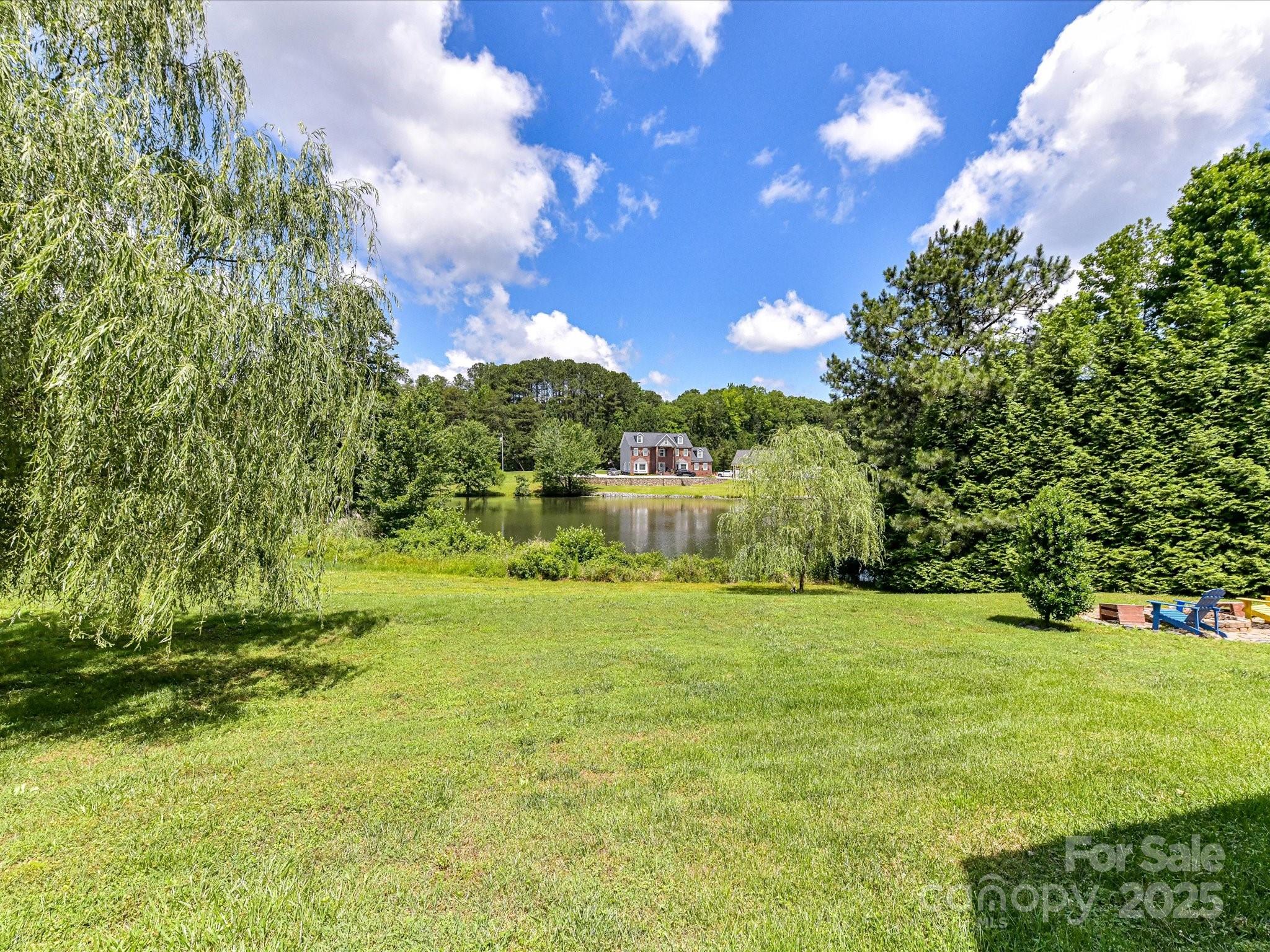 2325 Perry Road Denver, NC 28037 - Photo 44 of 48 a view of a garden with a building in the background