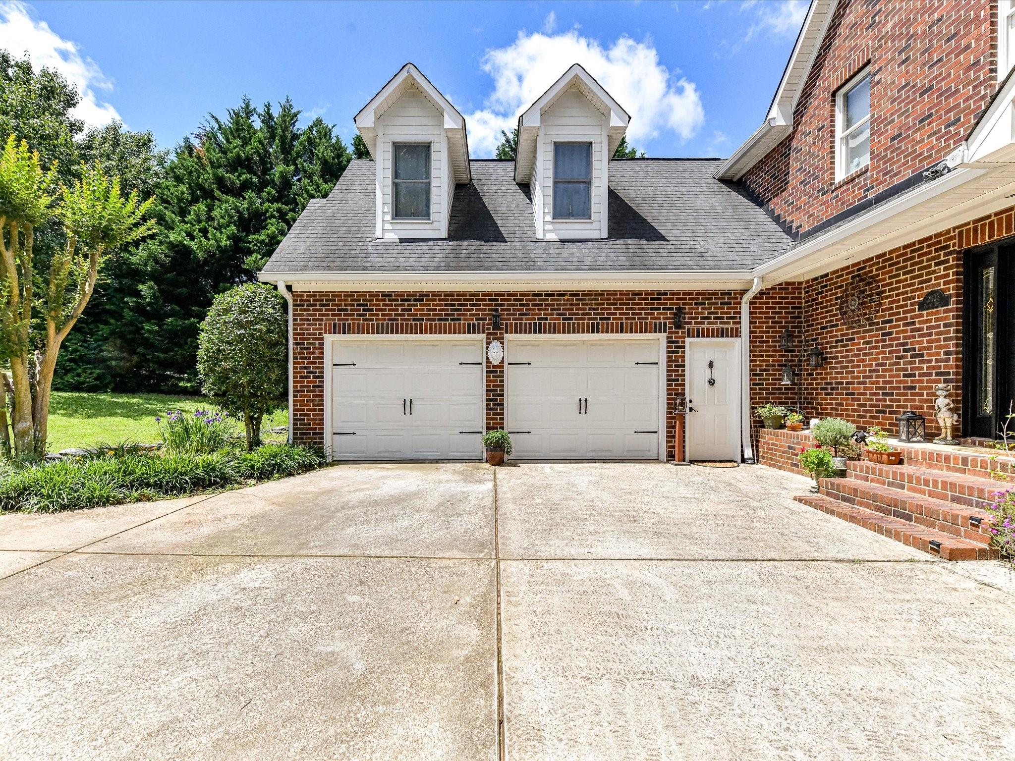 2325 Perry Road Denver, NC 28037 - Photo 5 of 48 a front view of a house with a yard and garage