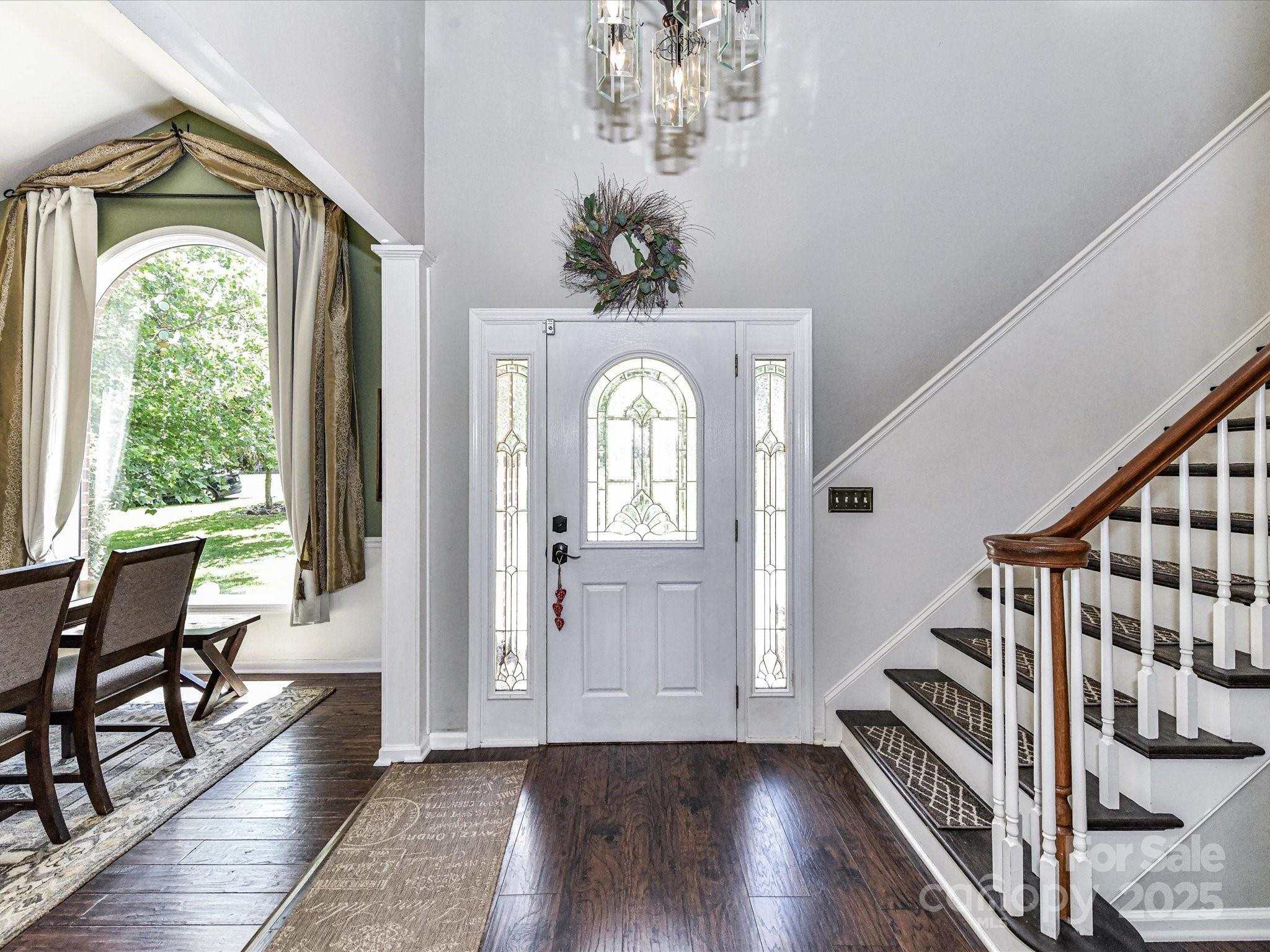 2325 Perry Road Denver, NC 28037 - Photo 7 of 48 a view of a hallway with wooden floor windows and stairs