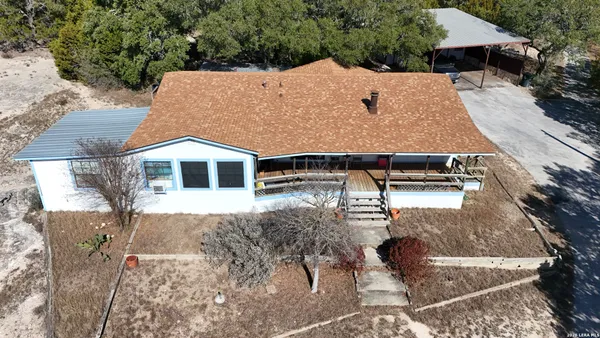 a aerial view of a house with a yard
