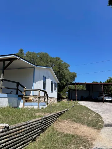 a kitchen with cabinets appliances and a sink