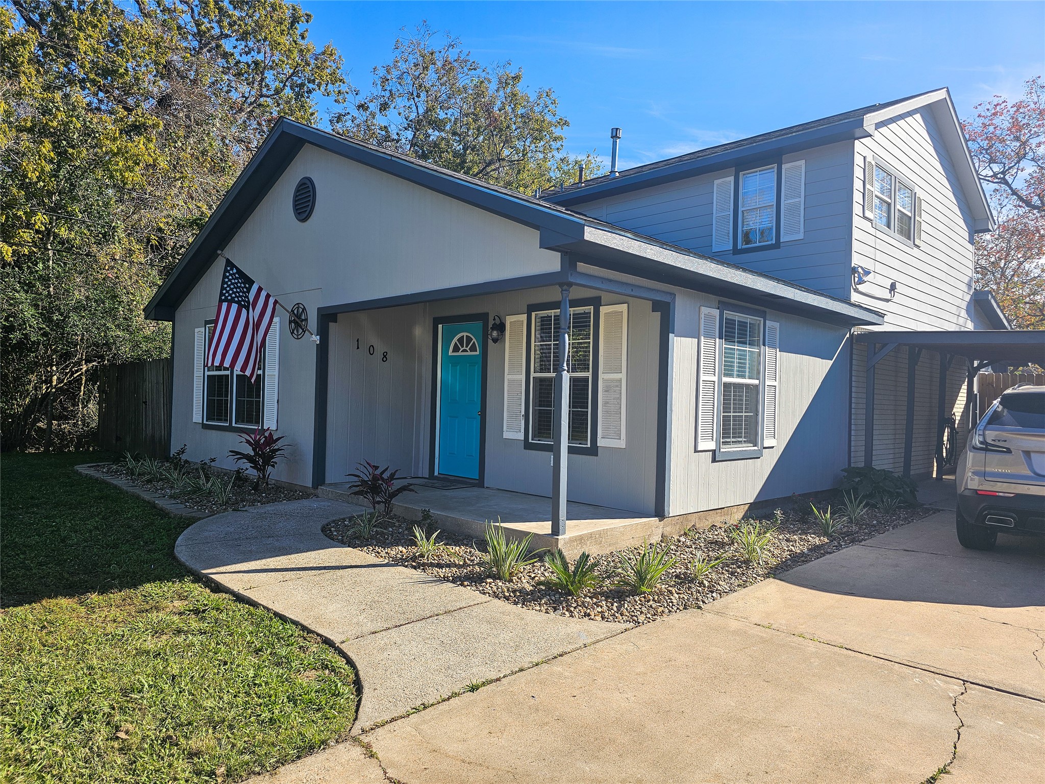 108 Oriole Lane Angleton, TX 77515 - Photo 1 of 20 a front view of a house with garden