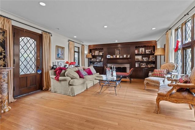 a living room with furniture and a bookshelf
