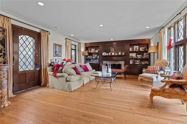 a living room with furniture and a bookshelf
