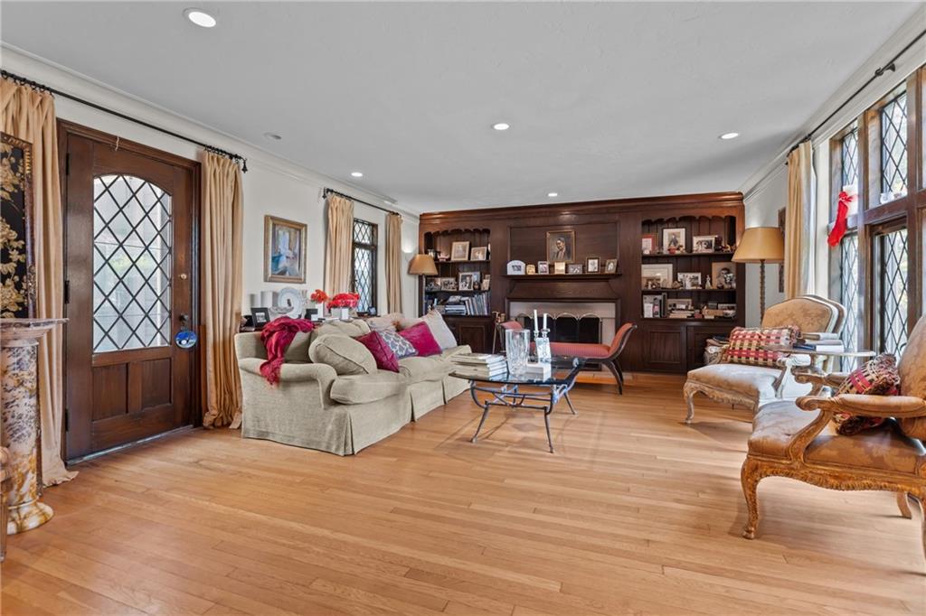 694 Valleyview Road Pittsburgh, PA 15243 - Photo 17 of 50 a living room with furniture and a bookshelf