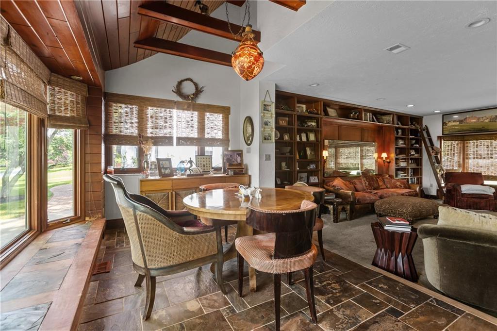 694 Valleyview Road Pittsburgh, PA 15243 - Photo 23 of 50 a dining room with furniture a rug and a large window