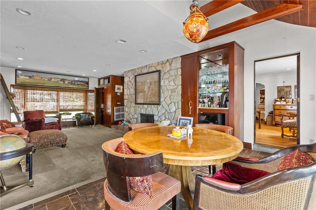 694 Valleyview Road Pittsburgh, PA 15243 - Photo 24 of 50 a dining room with furniture and a floor to ceiling window