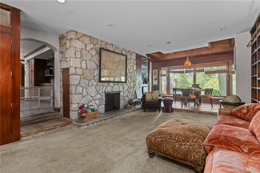 694 Valleyview Road Pittsburgh, PA 15243 - Photo 27 of 50 a living room with furniture and a fireplace