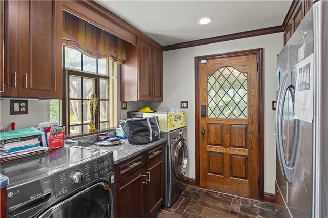 a kitchen with a window a sink and a counter