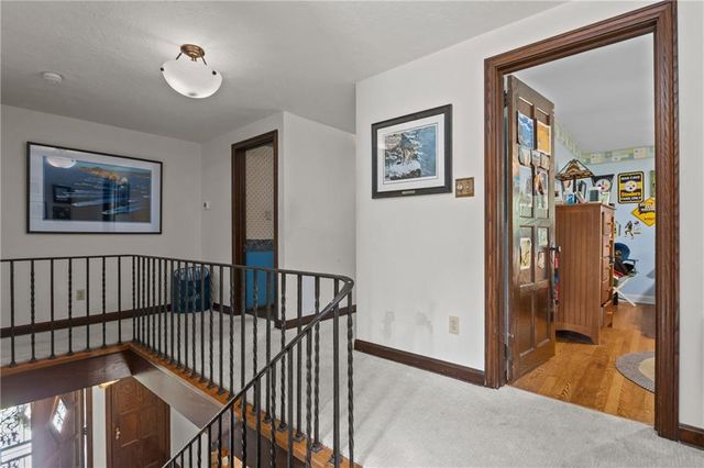 a bedroom with bed and a bookshelf