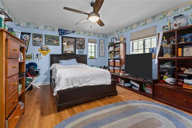 a bedroom with a bed and a dresser