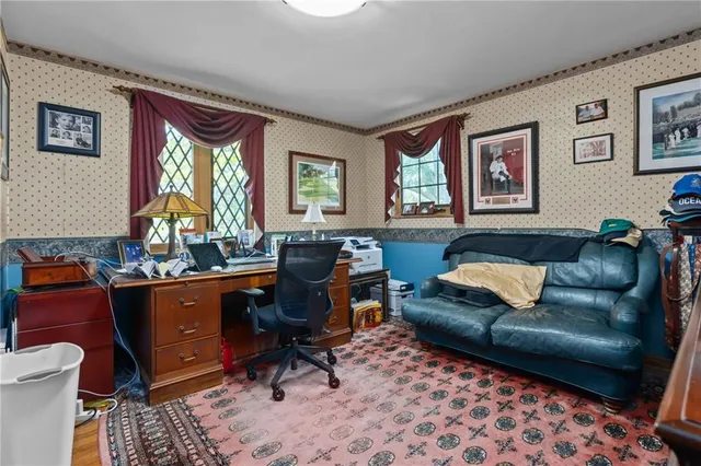 a room with a couch and a dresser