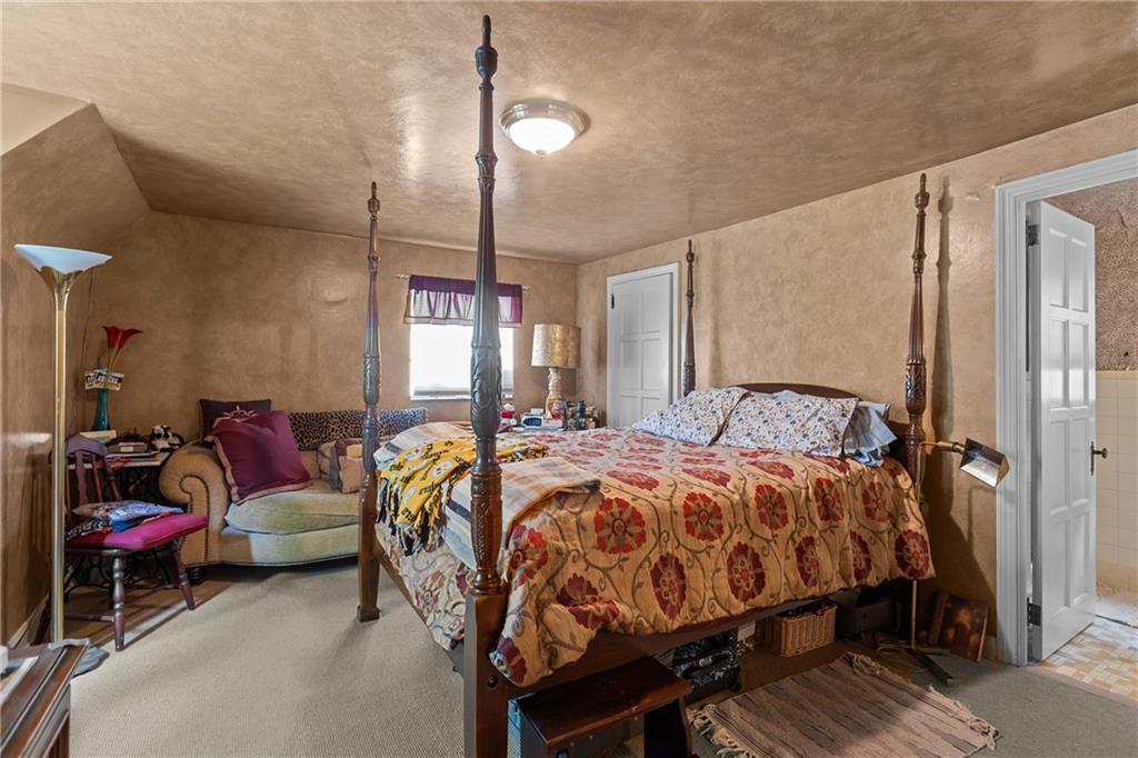 694 Valleyview Road Pittsburgh, PA 15243 - Photo 42 of 50 a bedroom with bed and a chandelier