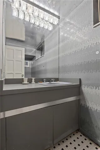 a work room with furniture and a large window