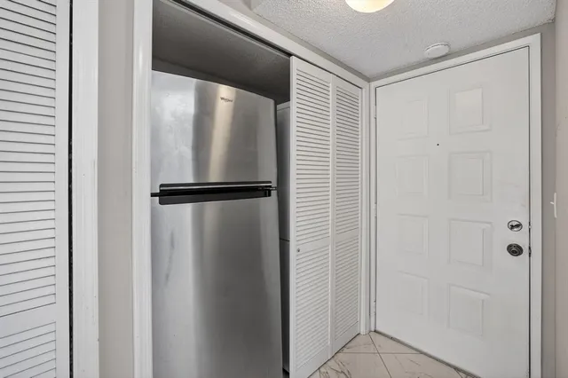 a view of room with a ceiling fan
