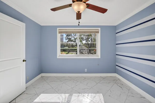 a bathroom with a double vanity sink mirror and toilet