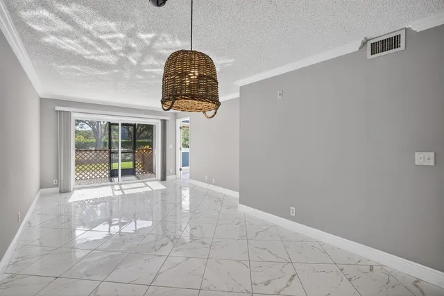 a view of an empty room with windows