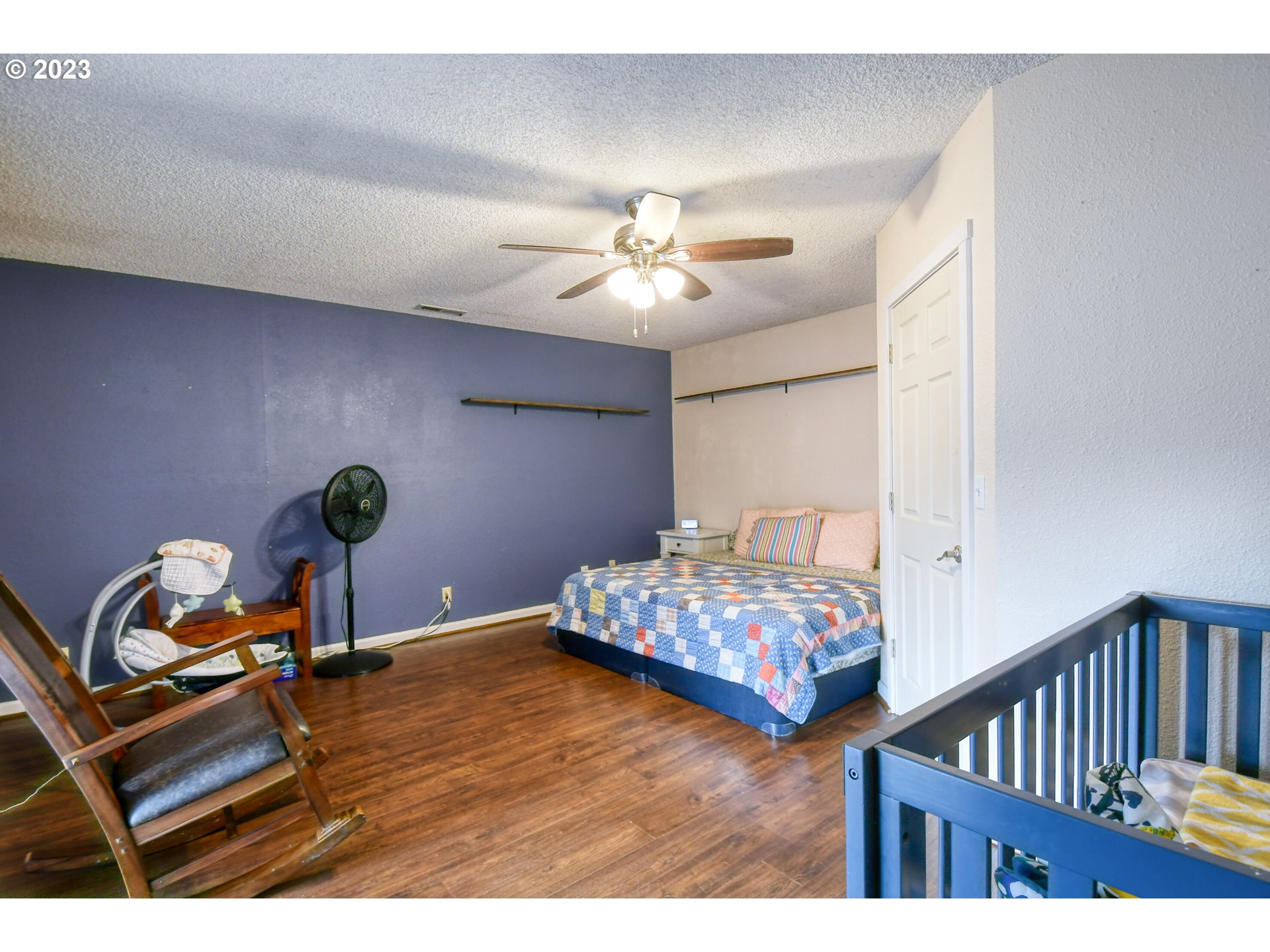 1522 Southwest 40th Place Pendleton, OR 97801 - Photo 15 of 32 a bedroom with furniture and a chandelier