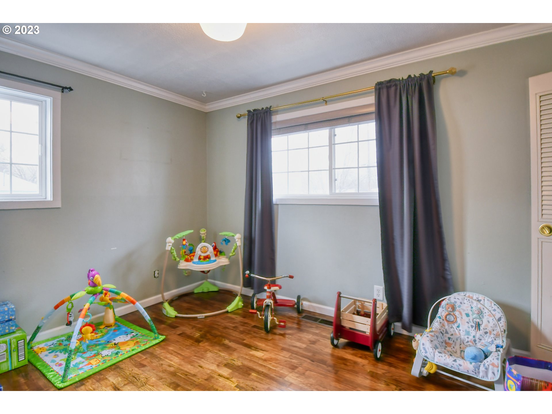 1522 Southwest 40th Place Pendleton, OR 97801 - Photo 22 of 32 a bedroom with toys and a wooden floor