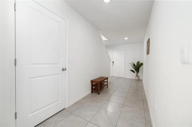 a view of room with furniture and a potted plant