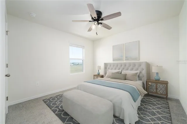 a bedroom with a bed and window