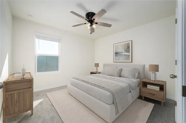 a bedroom with a large bed and a window