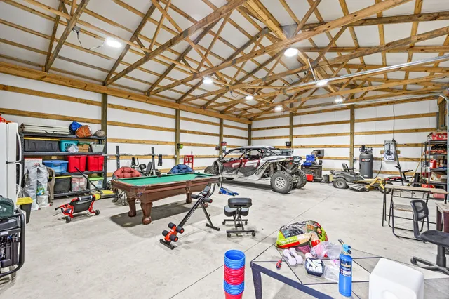 a house view with swimming pool in front of it