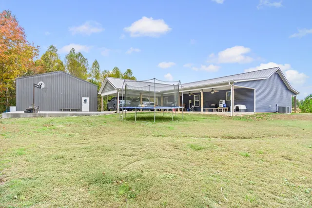 a view of a lake with houses in the back