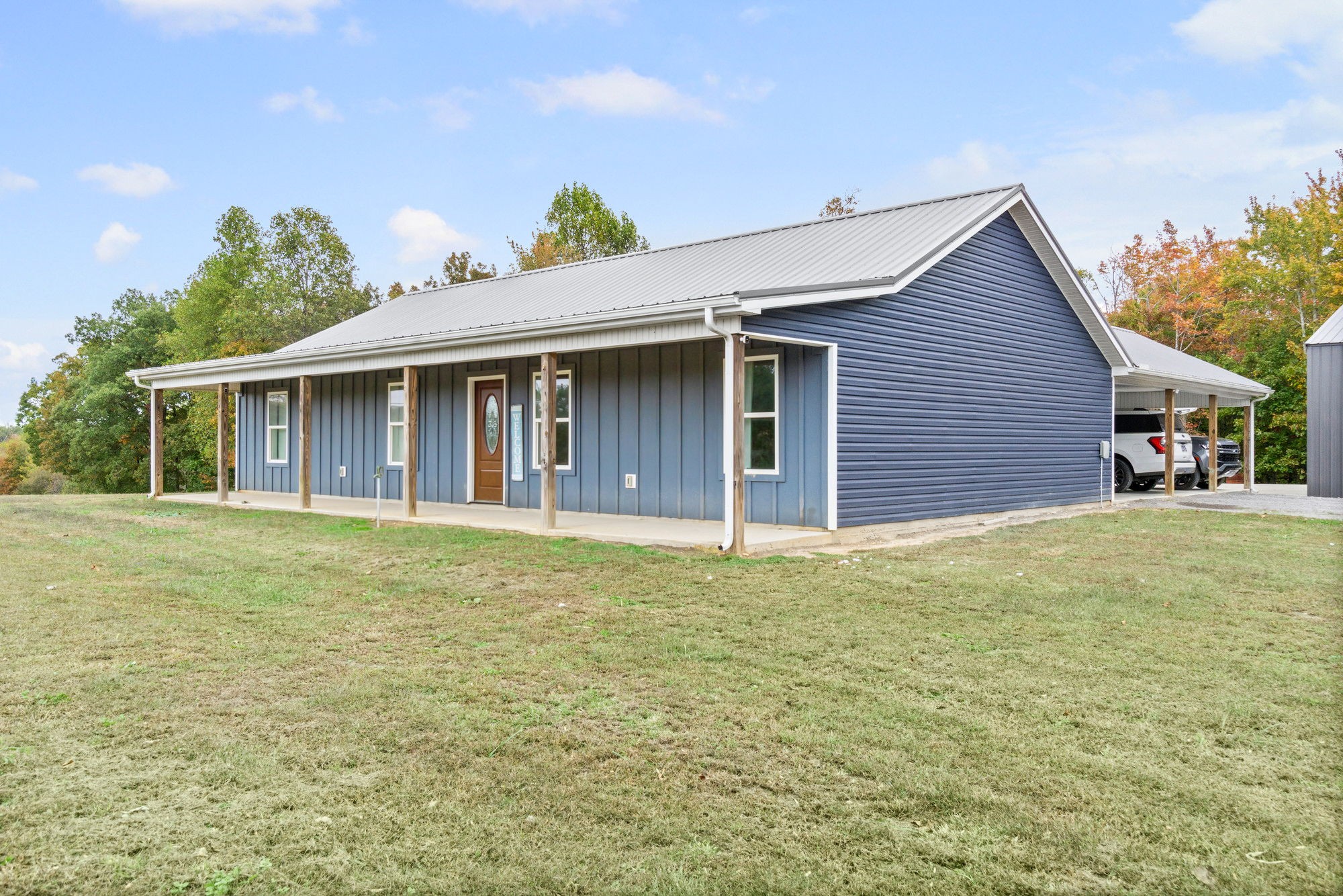 3365 Pea Ridge Road Liberty, TN 37095 - Photo 19 of 24 a front view of a house with a garden