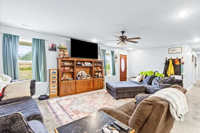 a living room with furniture and a flat screen tv