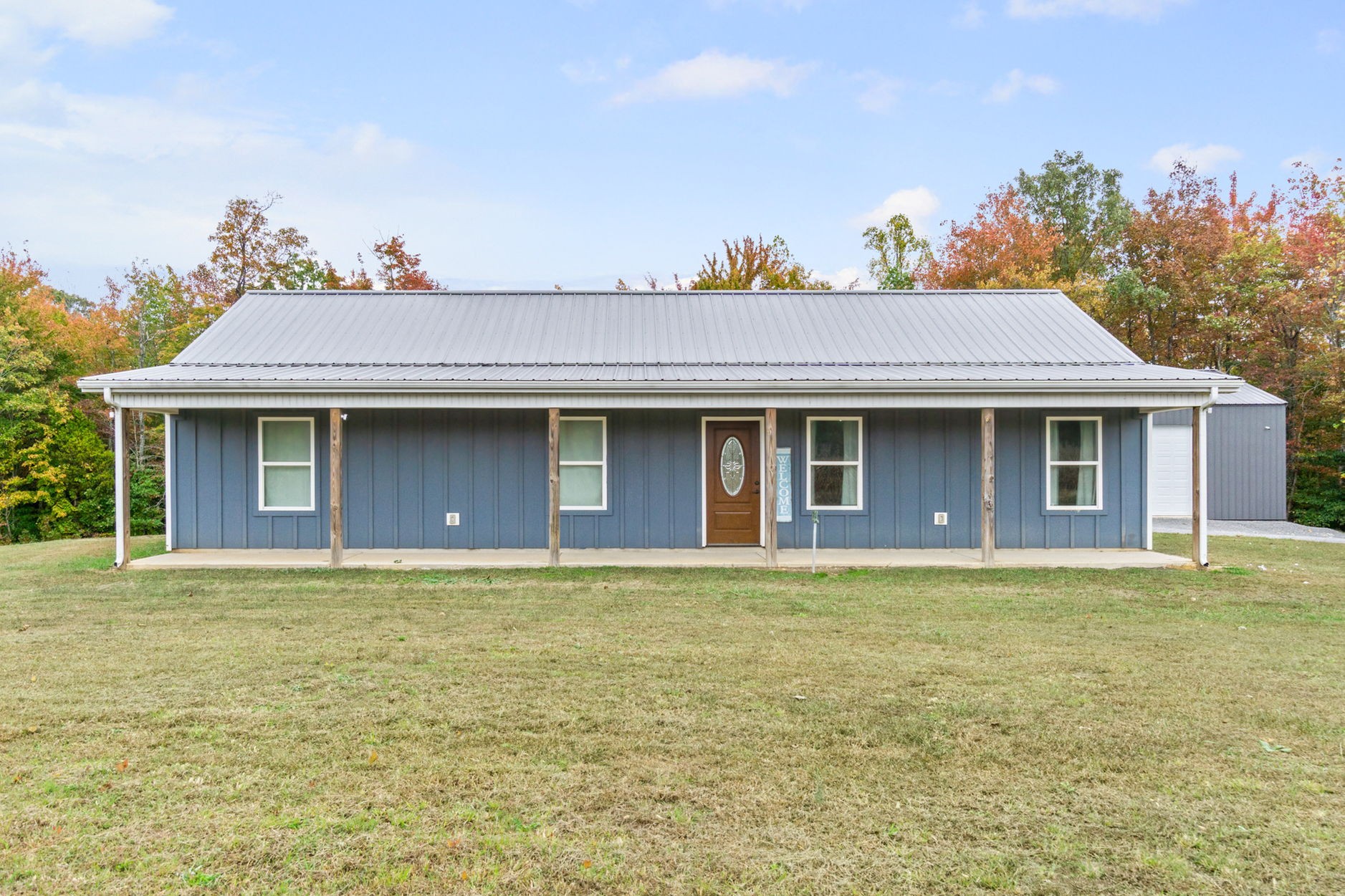 3365 Pea Ridge Road Liberty, TN 37095 - Photo 21 of 24 a front view of a house with a yard and garage