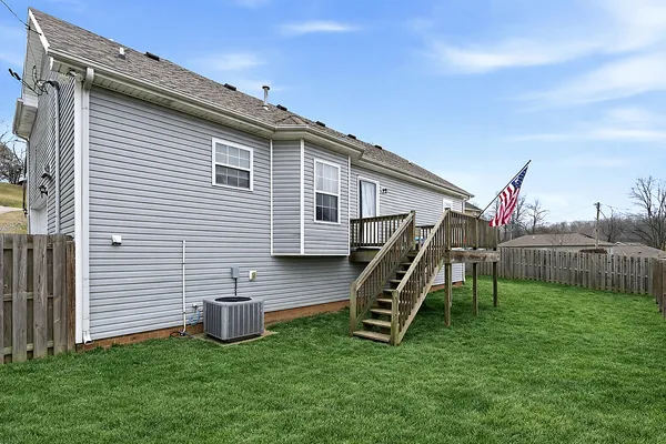 a view of a house with backyard