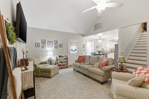 a living room with furniture and a flat screen tv
