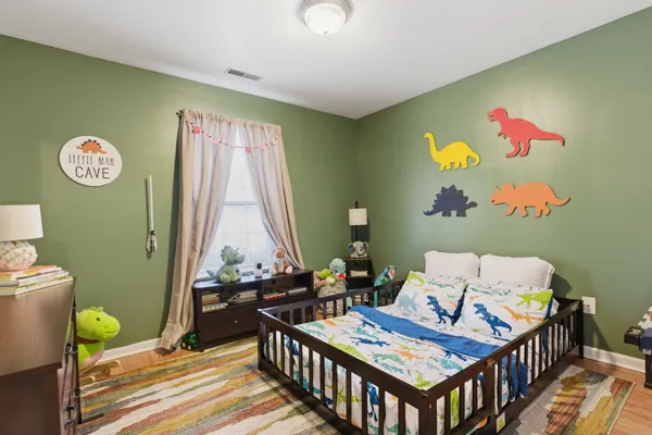 a bed room with furniture and a window