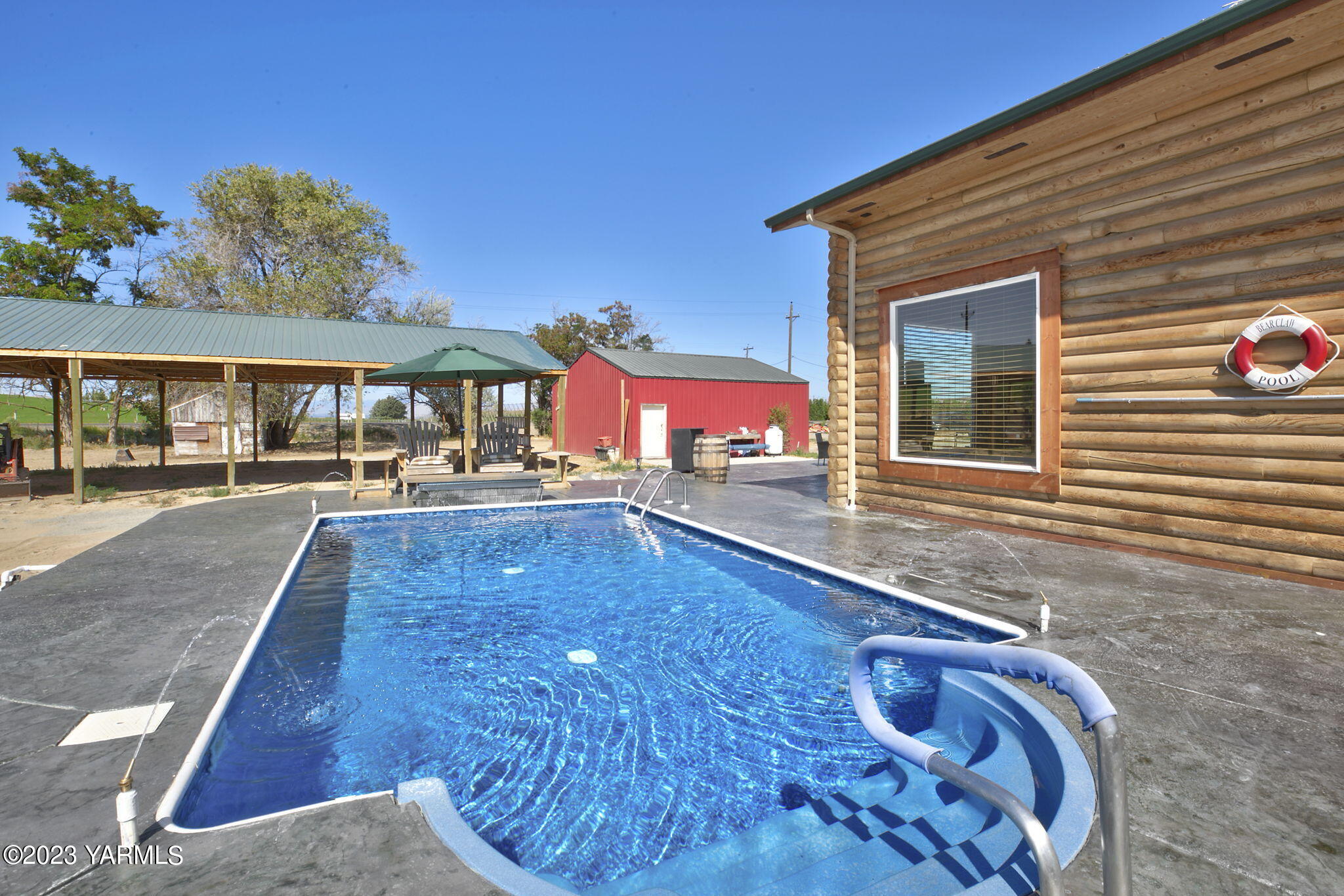 641 Walters Road Moxee, WA 98936 - Photo 18 of 23 a view of a house with a swimming pool