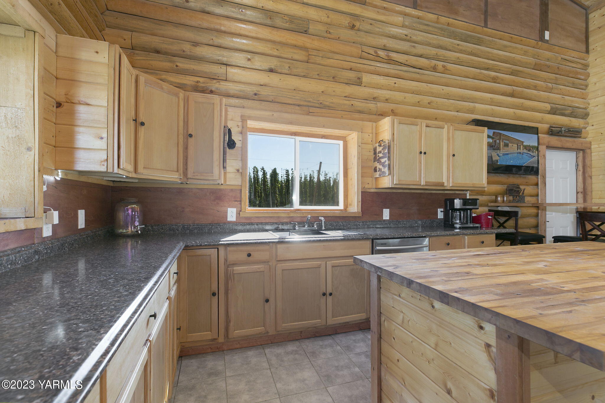 641 Walters Road Moxee, WA 98936 - Photo 5 of 23 a kitchen with a sink stove and cabinets